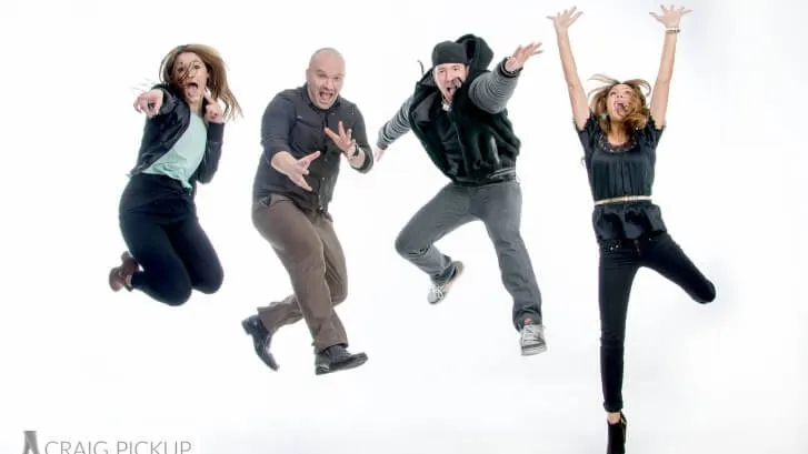 Four people jumping in the air together