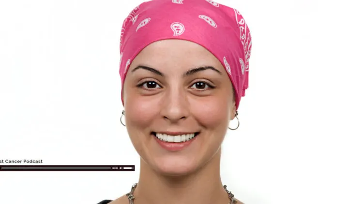 Woman in a pink headscarf smiling during cancer treatment