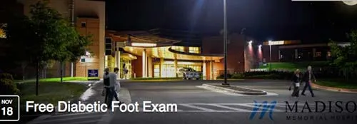 Free Diabetic Foot Exam notice over the hospital at night, November 18