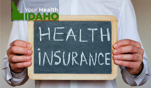 Chalk board with the words Heath insurance on it