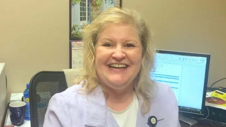 Madisonhealth provider in a white coat at her desk