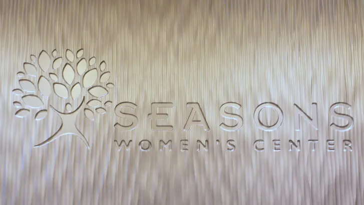 Seasons Women's Center sign etched into a wall