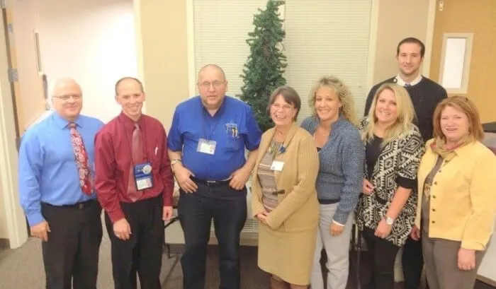 Group of Madisonhealth staff posed together in a corridor
