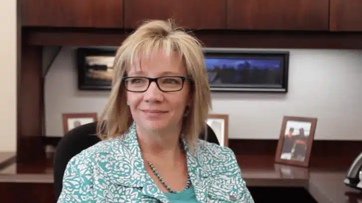 Madisonhealth staff member with glasses being interviewed in an office