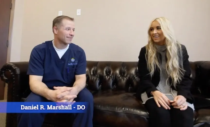 Daniel R. Marshall, DO, being interviewed on a sofa