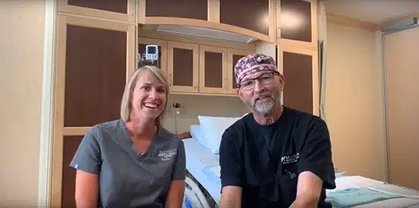 Two Madisonhealth staff members sitting together in a patient room