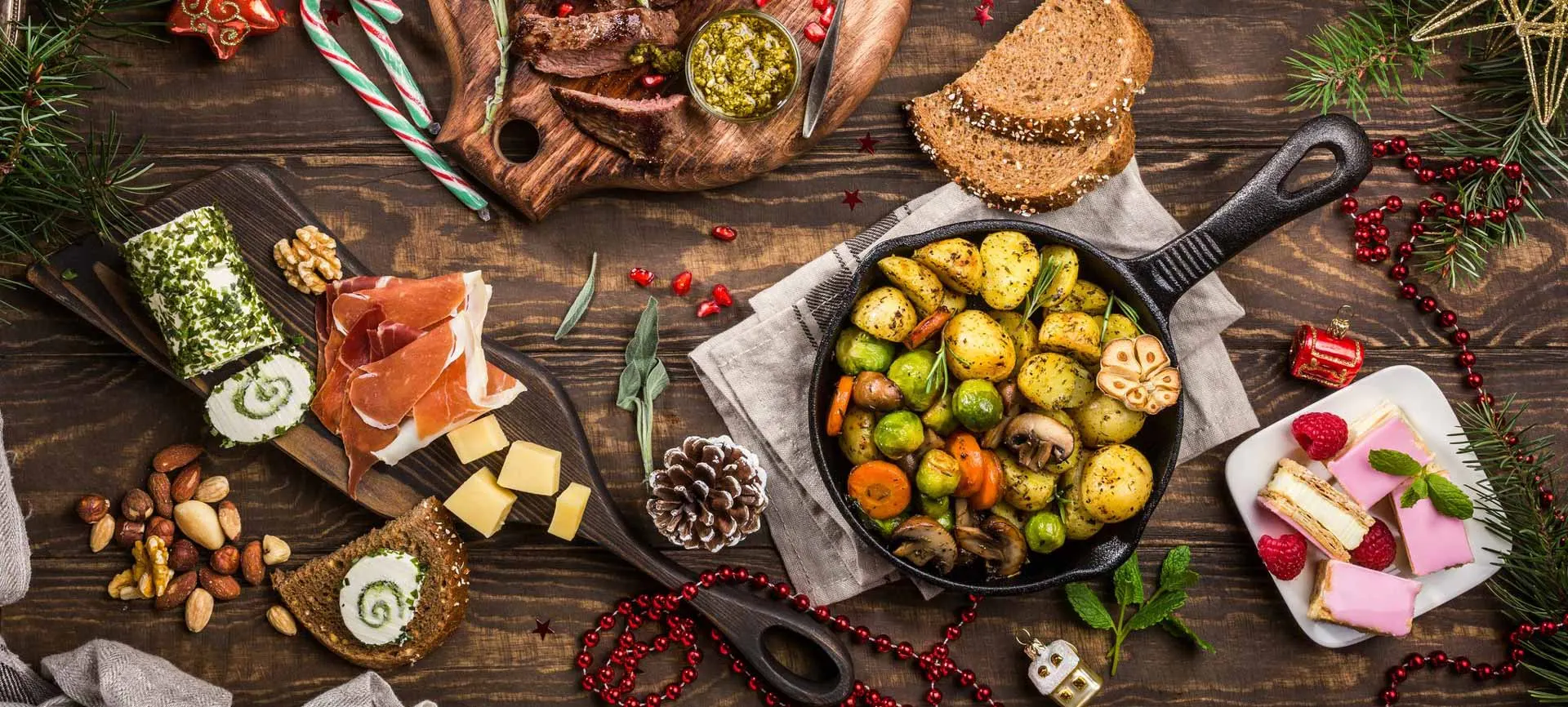 Festive holiday spread of cheeses, breads, nuts and roasted vegetables