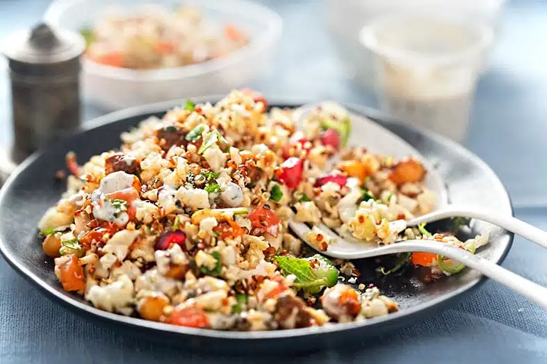 Pan of quinoa salad with roasted vegetables