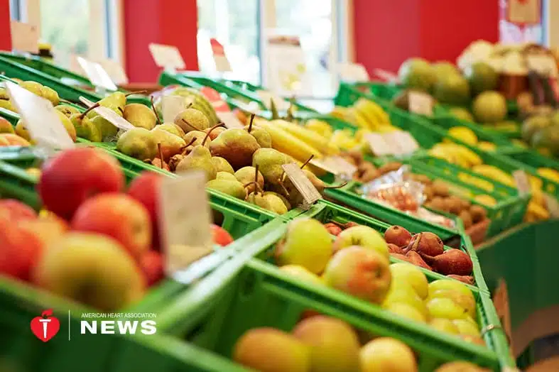 Crates of fresh fruit and vegetables in a grocery store
