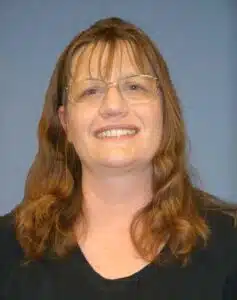 Madisonhealth staff portrait: woman with glasses and long auburn hair