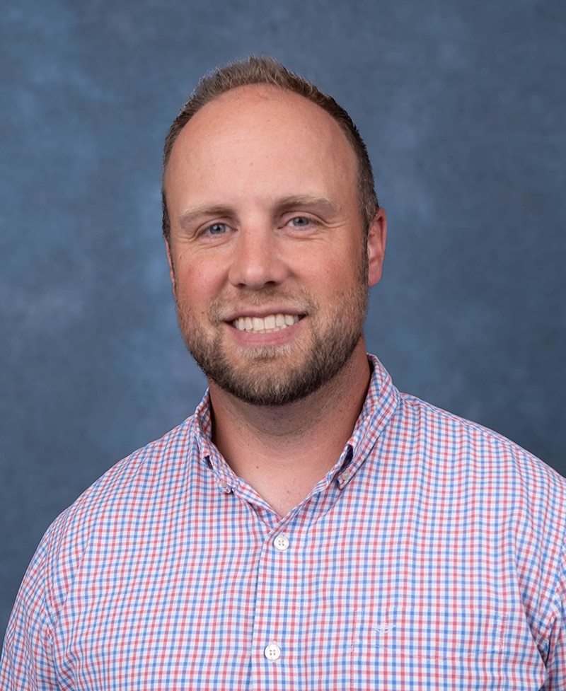 Orthopedic Physician Assistant Portrait on blue background