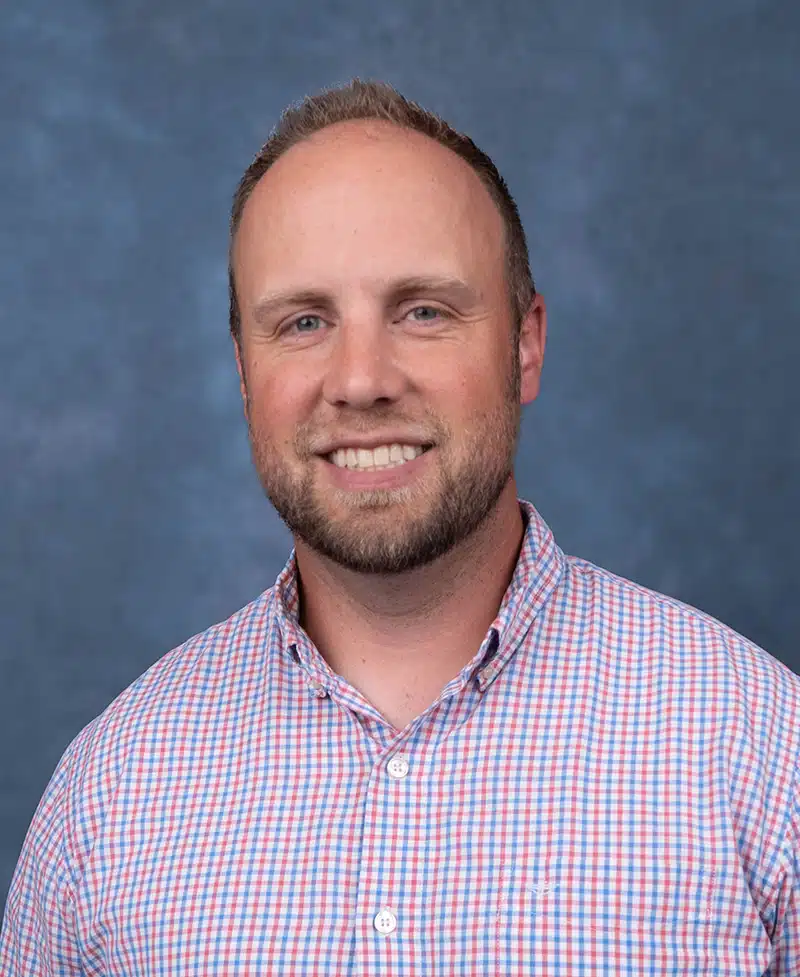 Orthopedic Physician Assistant Portrait on blue background