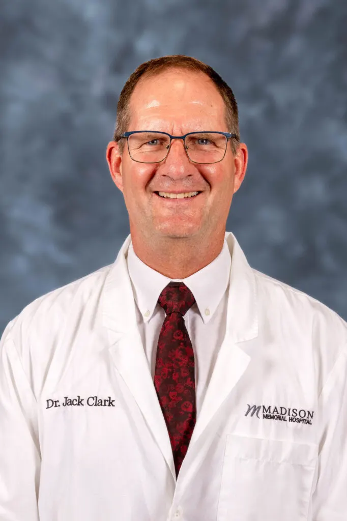 Dr. Jack Clark in a Madison Memorial Hospital white coat and patterned red tie