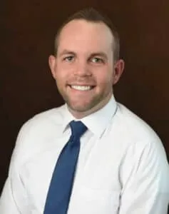 Madisonhealth staff portrait: man in a white shirt and navy tie