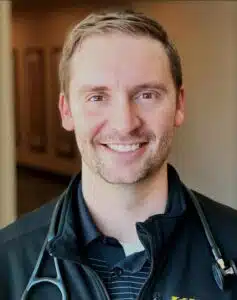 Madisonhealth provider portrait: man in a black jacket wearing a stethoscope