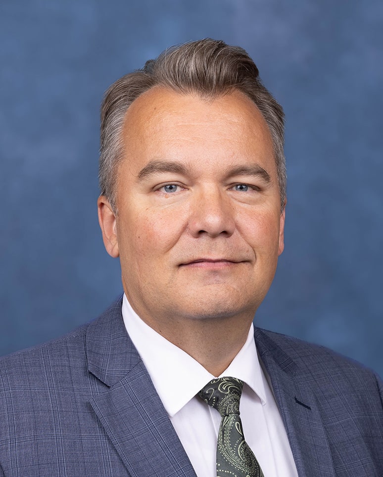 Internal Medicine Physician portrait with blue background