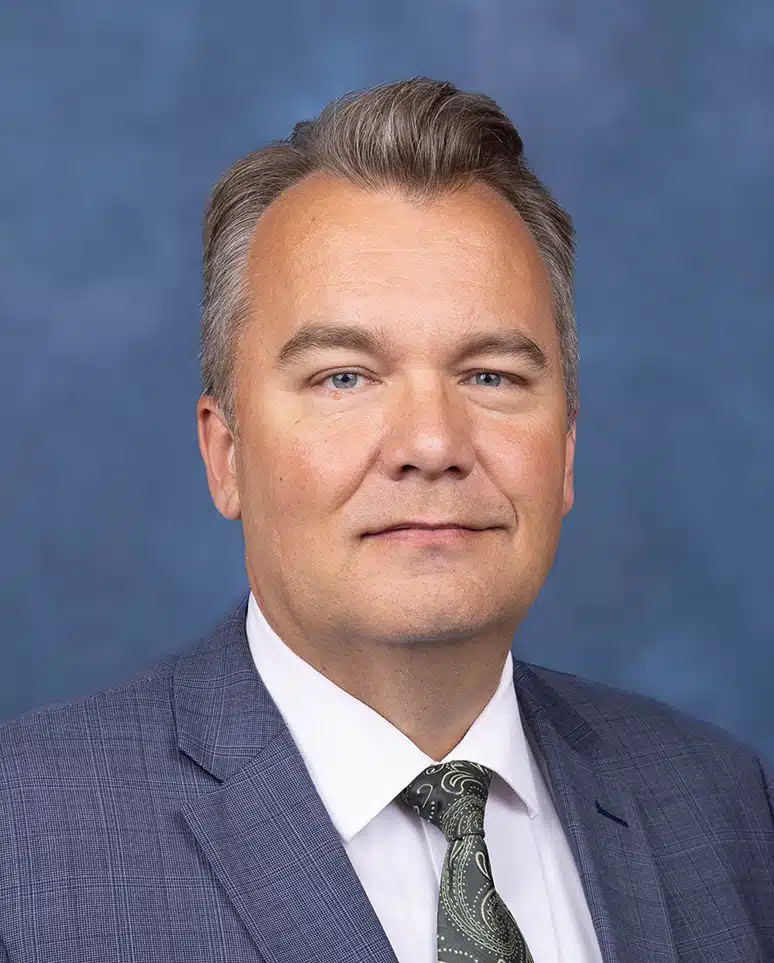 Internal Medicine Physician portrait with blue background
