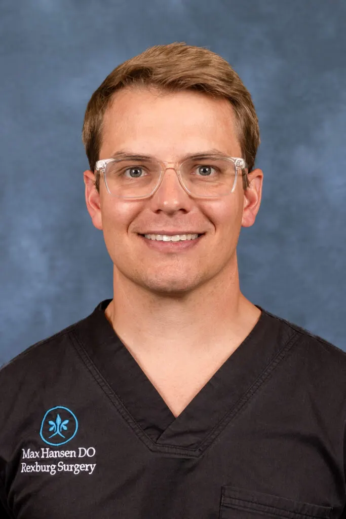 Max Hansen, DO, of Rexburg Surgery, in black scrubs and protective eyewear