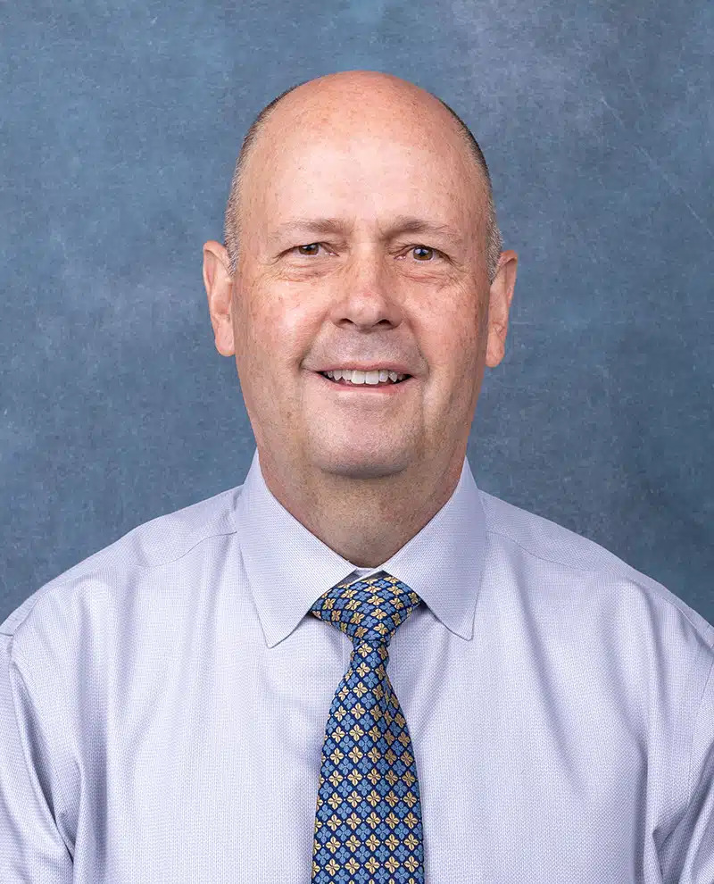 Primary Care physician portrait on blue background