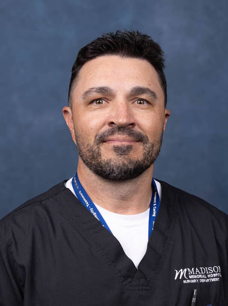 OB-GYN Physician portrait on blue background