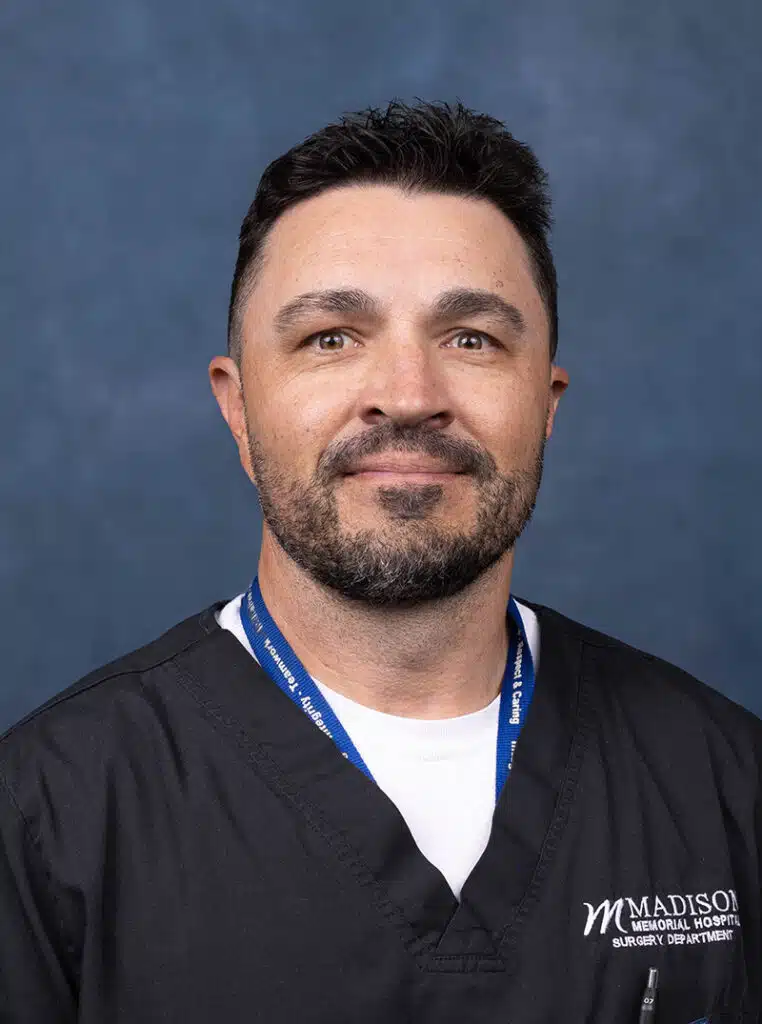 OB-GYN Physician portrait on blue background