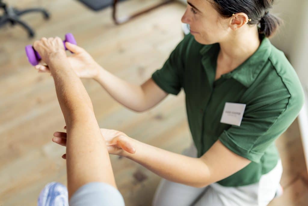Occupational Therapist working with a patient.