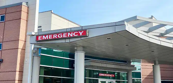 Emergency department entrance at Madisonhealth with its red Emergency sign