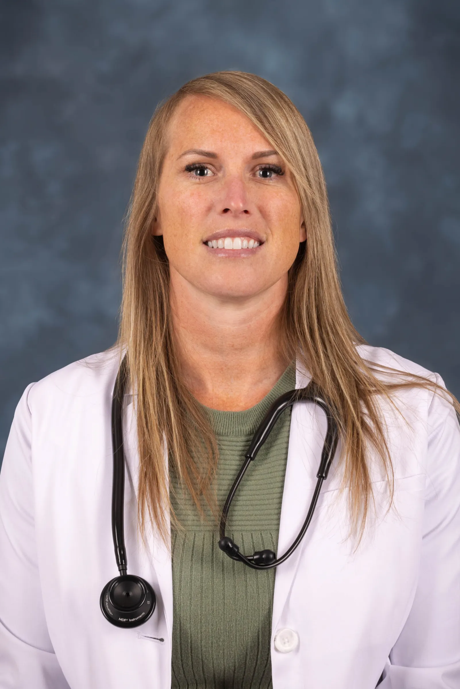 Madisonhealth provider portrait: woman in a white coat with a stethoscope