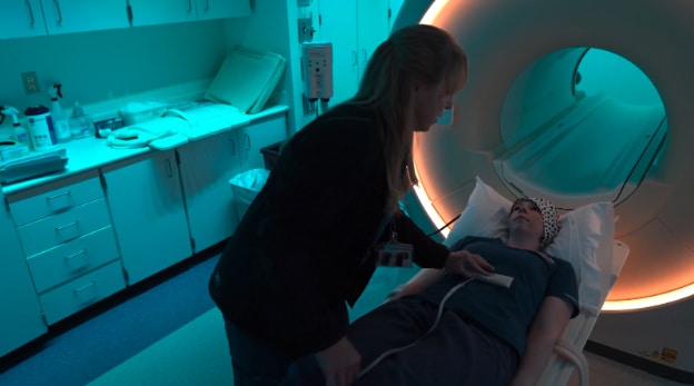 Ana-Struhs-prepares-a-patient-for-the-MRI-machine