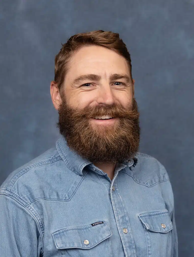 OB-GYN Physician portrait on blue background