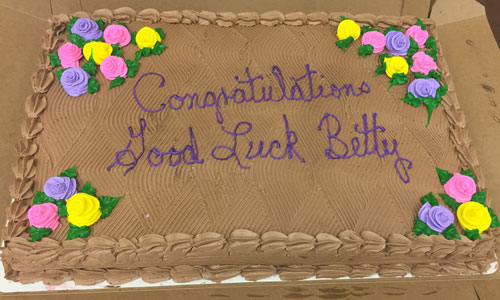 chocolate cake with Congratulations, good luck betty written on it