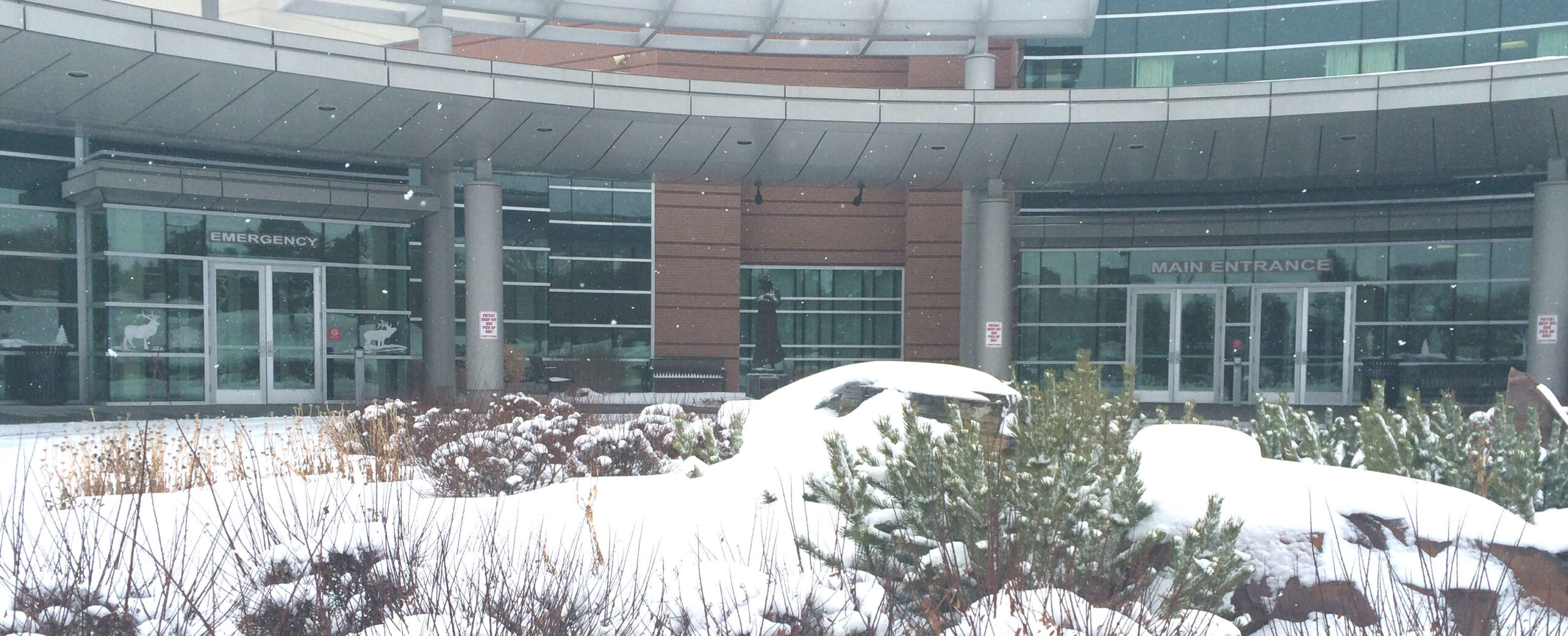The front of the Madison Memorial Hospital in the winter, snow on the ground