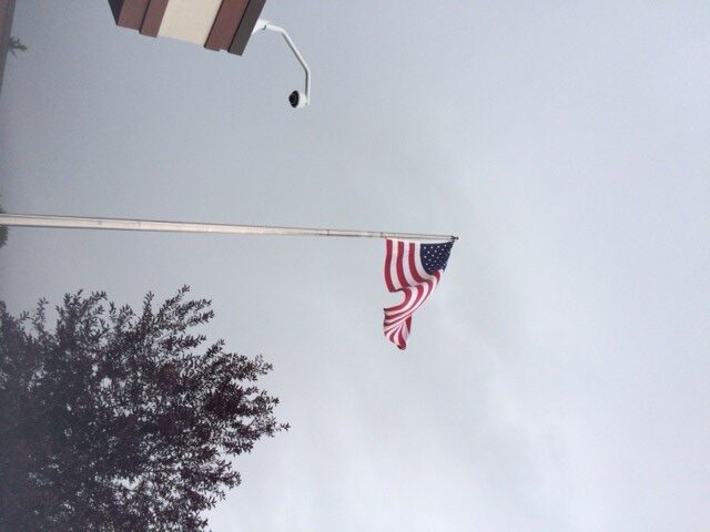 rainy skies and the american flag