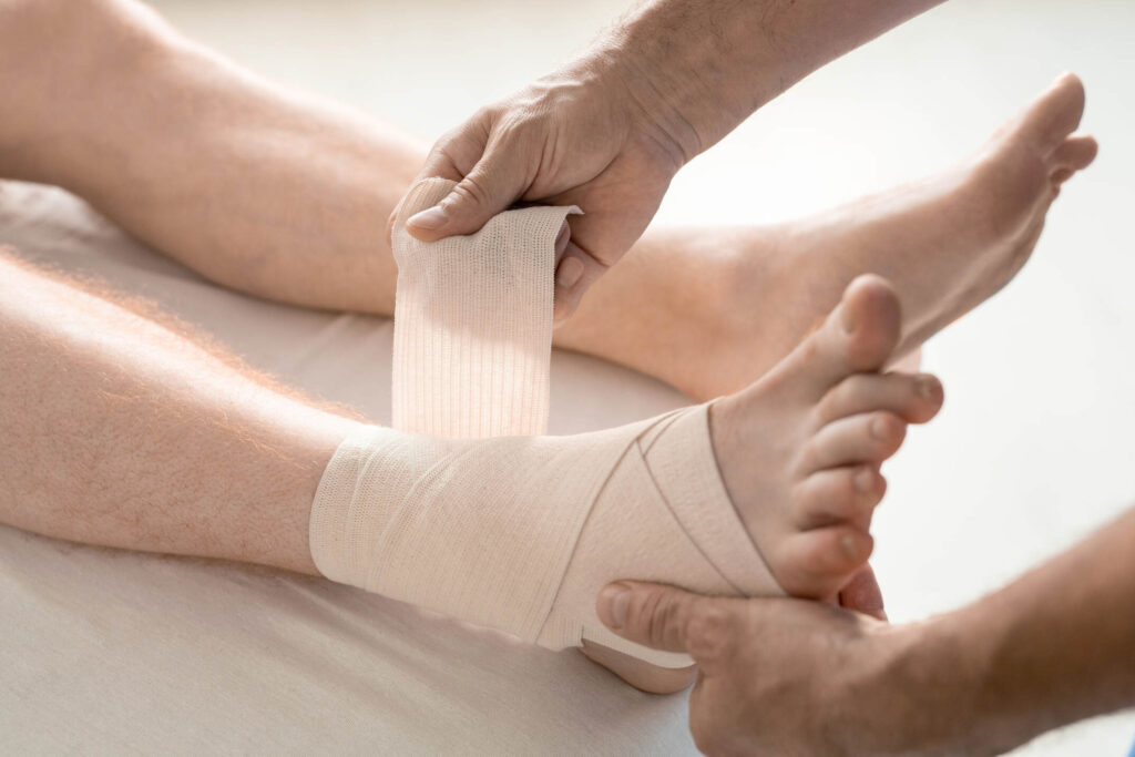 A foot being wrapped with gauze