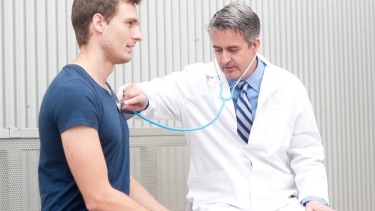 Young man having a checkup with a doctor